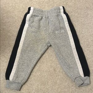 Nike Kids Gray Joggers with Black & White Stripes